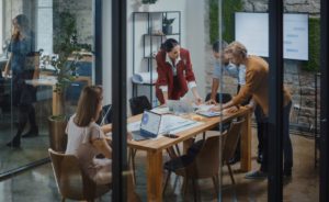 group of people in the office discussing geospatial services