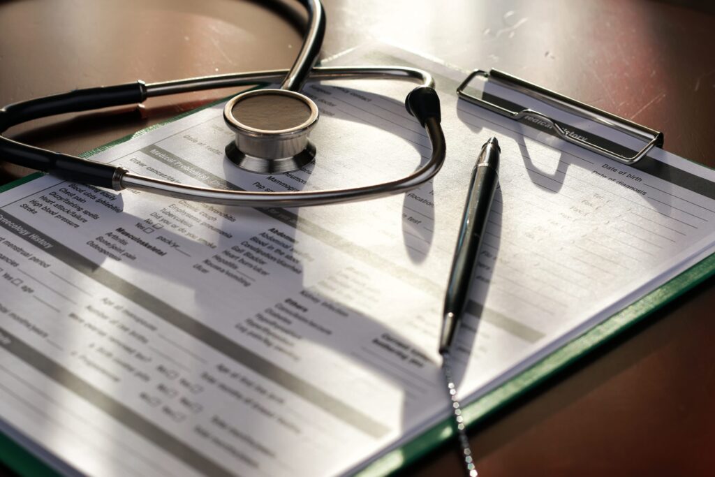 DOcuments with stetoscope on table