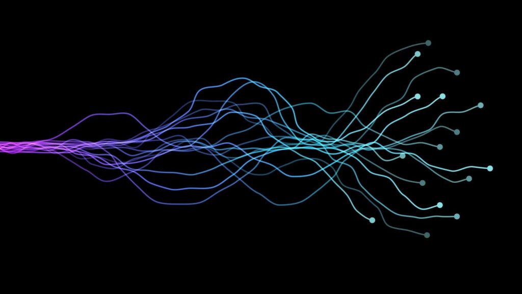 Abstract visualisation of flowing data lines forming branching connections on a dark background, shifting in colour from purple to blue and turquoise, representing AI, data processing and neural networks.