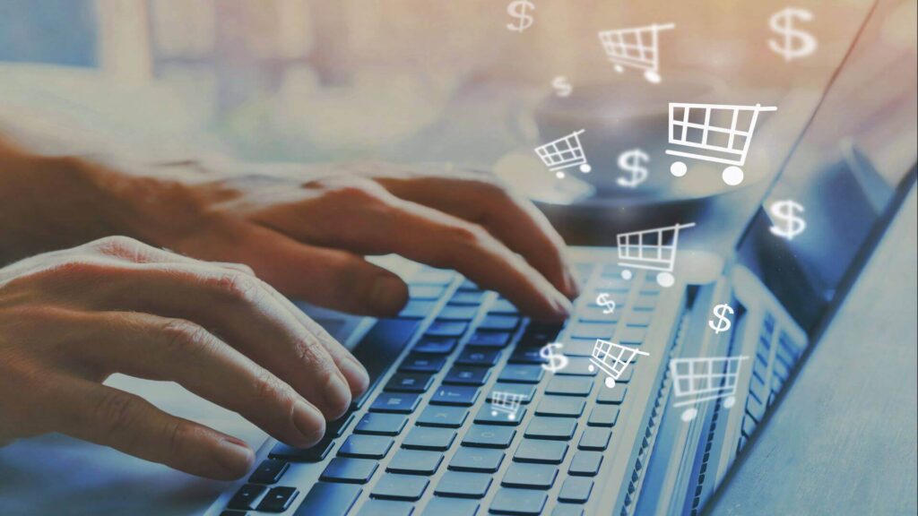 A symbolic picture of a laptop and a persons hands on the keyboard