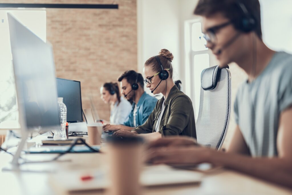 A team of call centre employees leveraging the functionality of Salesforce Service Cloud Voice.