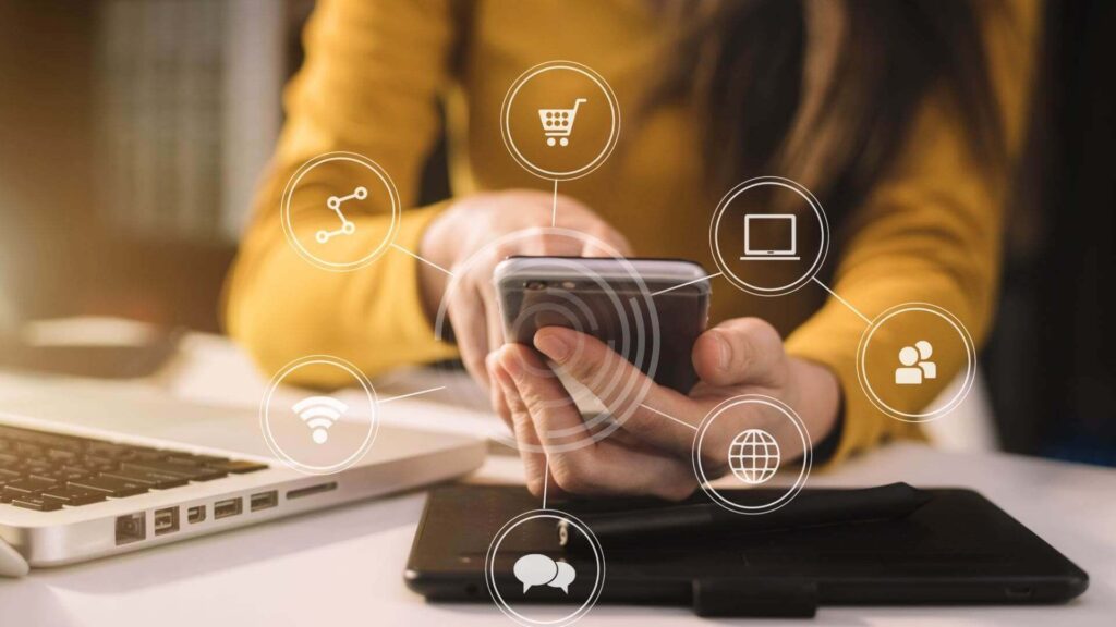 A mobile phone in the palm of a woman's hand