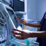 Healthcare professional using advanced medical device in hospital setting, symbolizing MedTech industry regulations and EU MDR vs MDD compliance changes