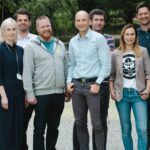 Spyrosoft and Qt team members standing together.