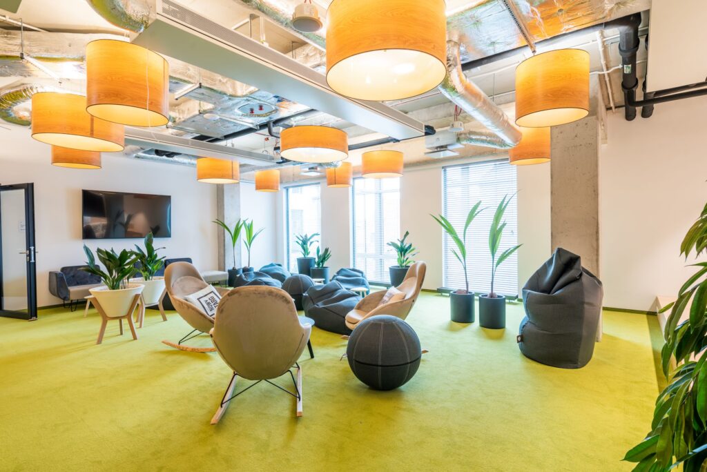 Modern office space with orange lights and green interior