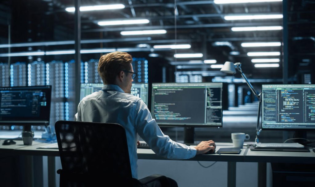 Cybersecurity expert looking at screen