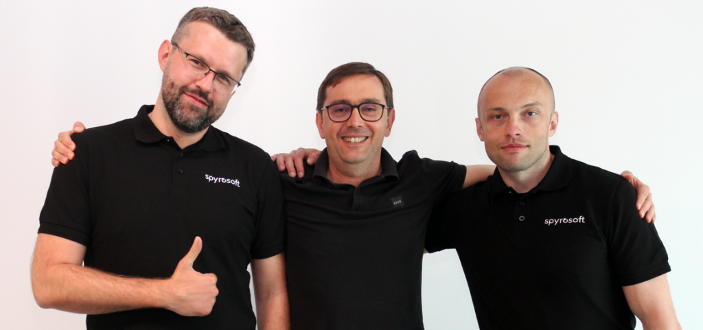 Three men in black Spyrosoft polo shirts, establishing Spyrosoft Connect.