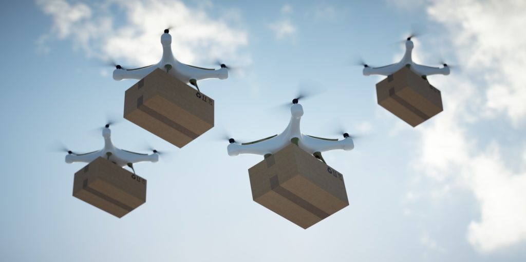 Improve robot connectivity with Staex; several robotic drones with parcels flying in the sky