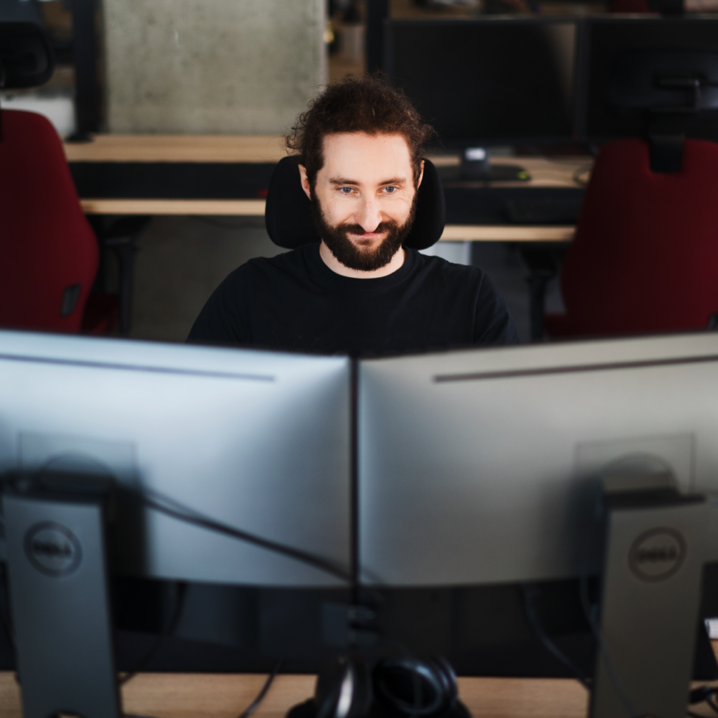 Expert looking at two screens