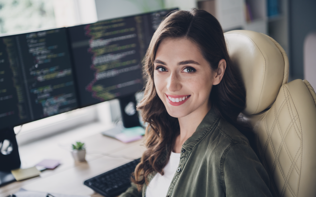 Edu Tech - educational experience - happy businesswoman looking into camera