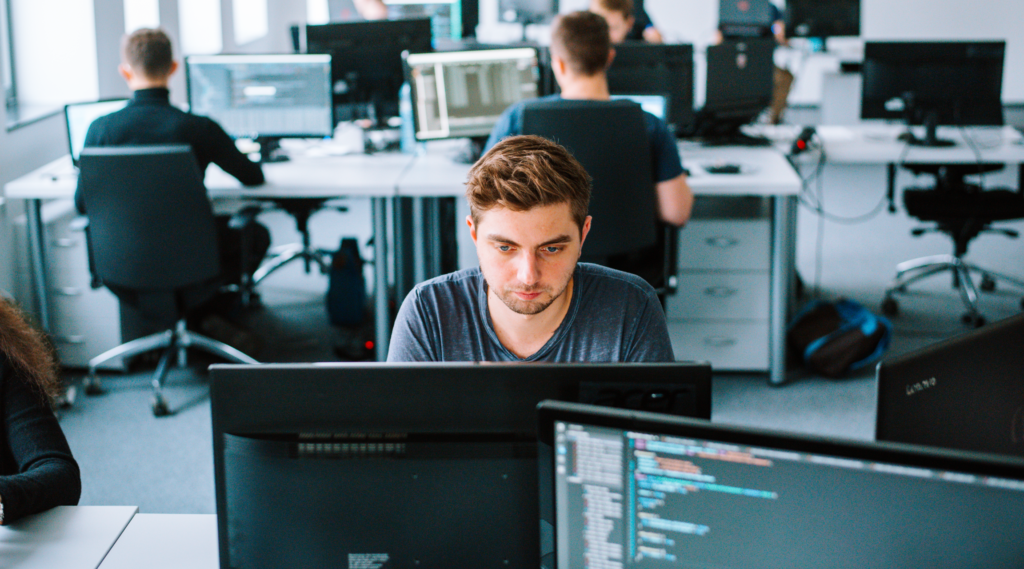 Software developers at Spyrosoft's office