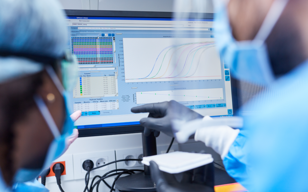 AI -  machine learning and data science - AI supporting doctors - doctors looking at charts displayed on a PC