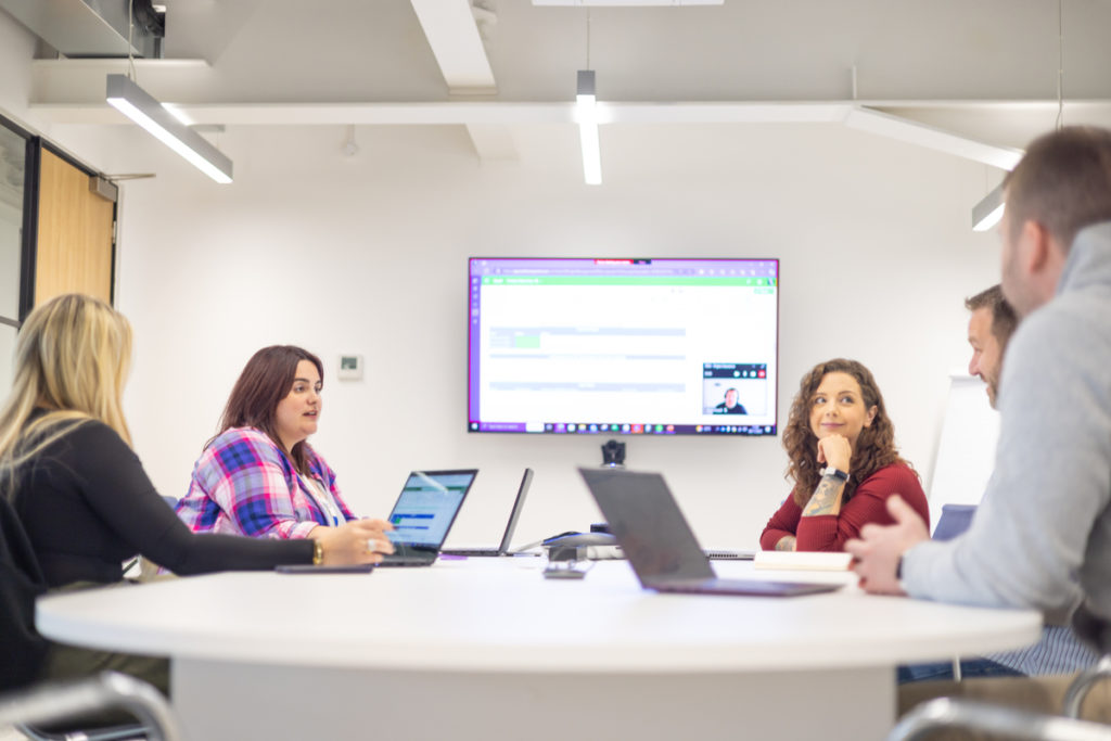People sitting at a desk at a law firm