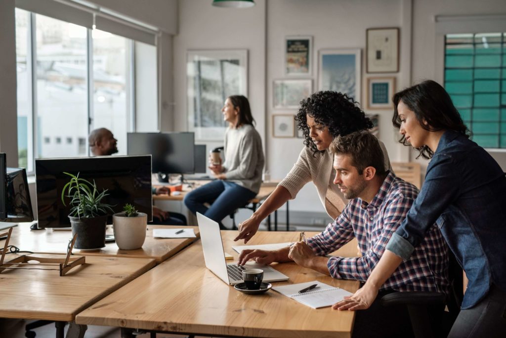 a group of people discussing establishing an external AI centre with the BOT engagement model while sitting in the office