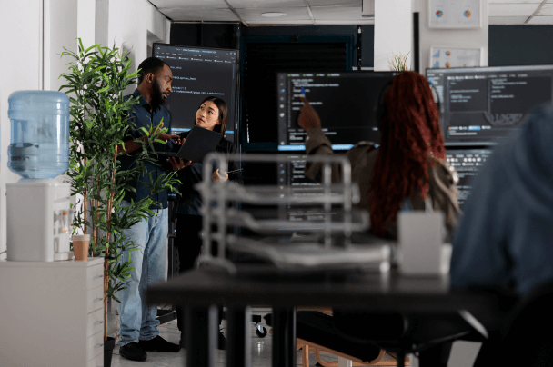 Laptop with code displayed on screen – software development for Connected TV App Framework