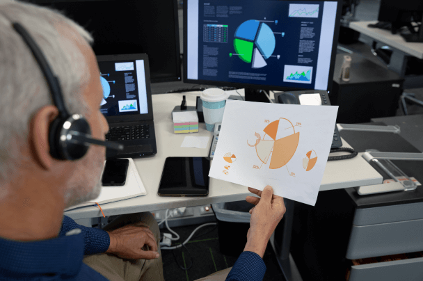 Professional analysing performance charts on screen – data insights in iGaming software development