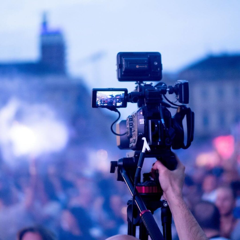 Professional camera recording live outdoor event – live streaming and broadcast production technology