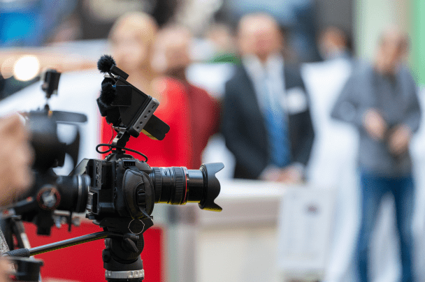 Event Organisers – video camera recording speakers during a press conference