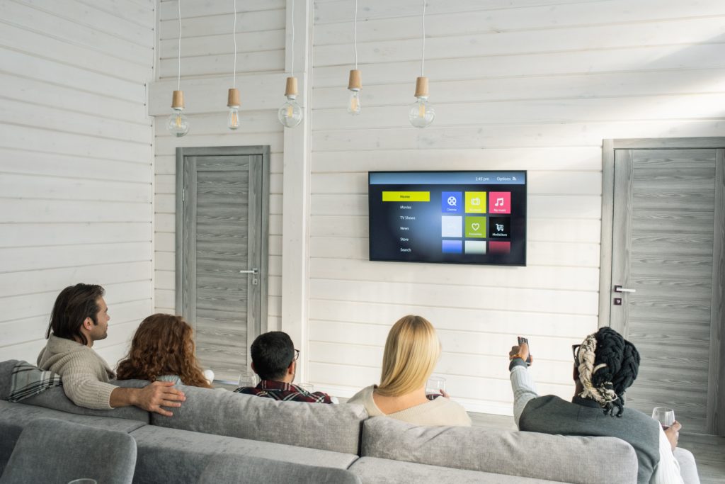 People using streaming services on TV.