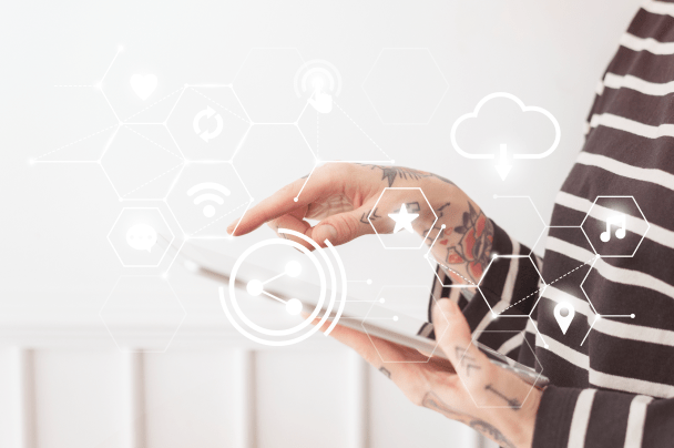 Telcos – woman using tablet device with holographic network and cloud technology icons