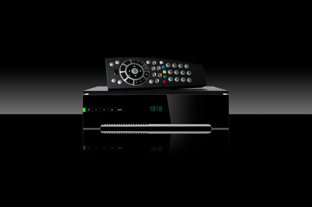 Telcos – digital set-top box and remote control representing television technology equipment