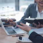 Two people discussing legacy modernisation in an office.