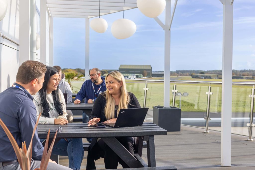 IT specialists on a meeting outside the office_IT staff augmentation services_team extension