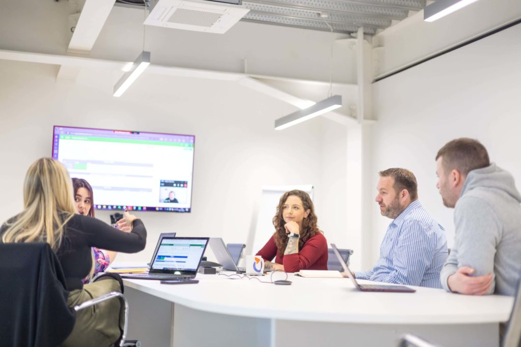 Spyrosoft team at the meeting_IT staff augmentation services_team extension hero