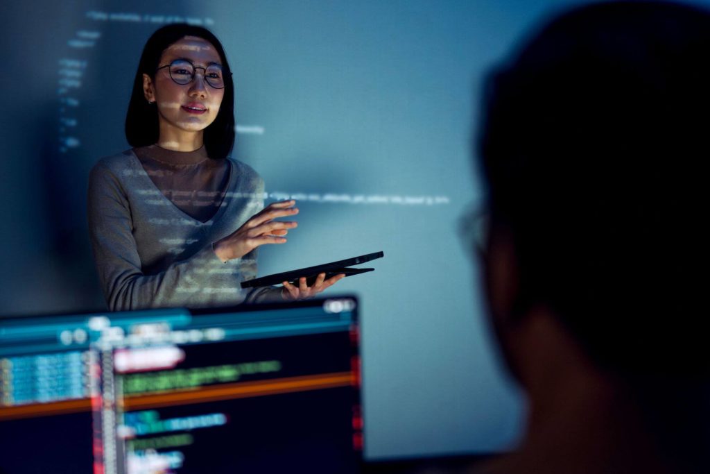Businesswoman presenting high-tech innovation to their colleagues