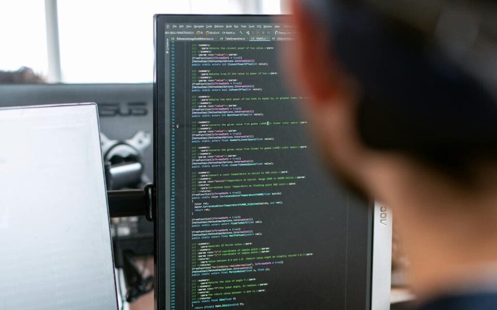 A software developer in front of a screen doing model based development