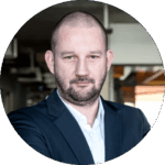 A portret picture of Piotr Intres, Business Unit Director of Robotics at Spyrosoft