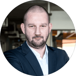 A portret picture of Piotr Intres, Business Unit Director of Robotics at Spyrosoft