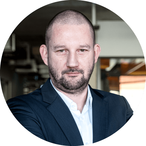 A portret picture of Piotr Intres, Business Unit Director of Robotics at Spyrosoft