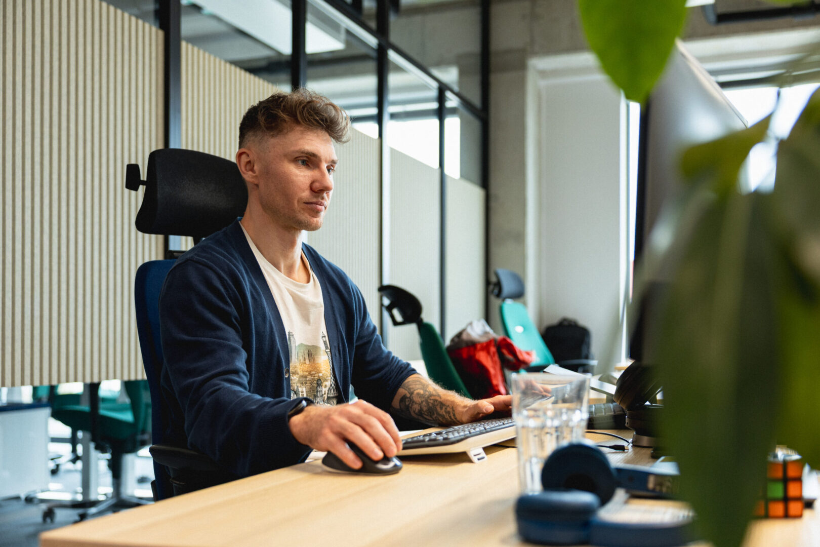 A man works on a computer in the Spyrosoft office in Wroclaw.