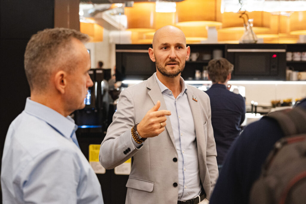 Spyrosoft employees in Cracow talk during one of the events organized by the company