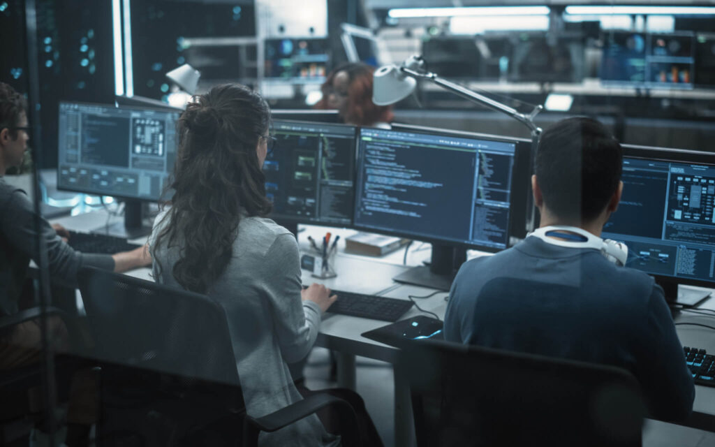 High Tech software. Custom platform & software development experts working on a new solution in a modern office