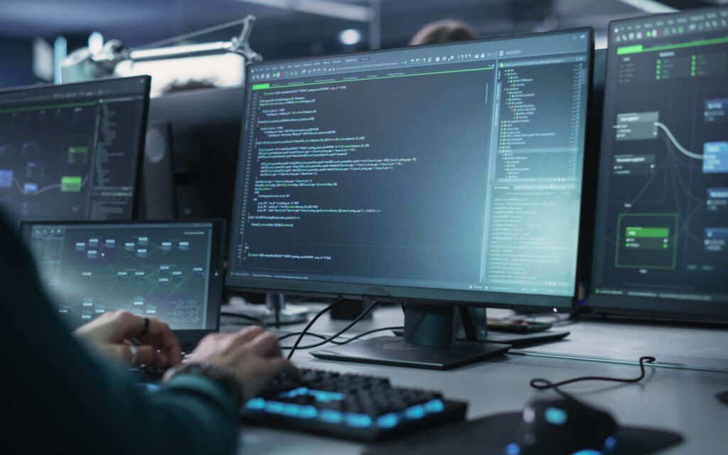 High Tech services. System integration and customisation. View of a written code on a desktop