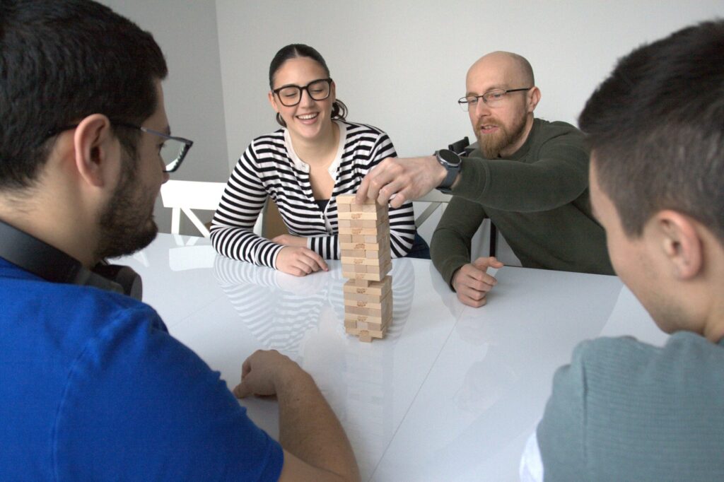 [image]-career-osijek office-a group of people bond over a game