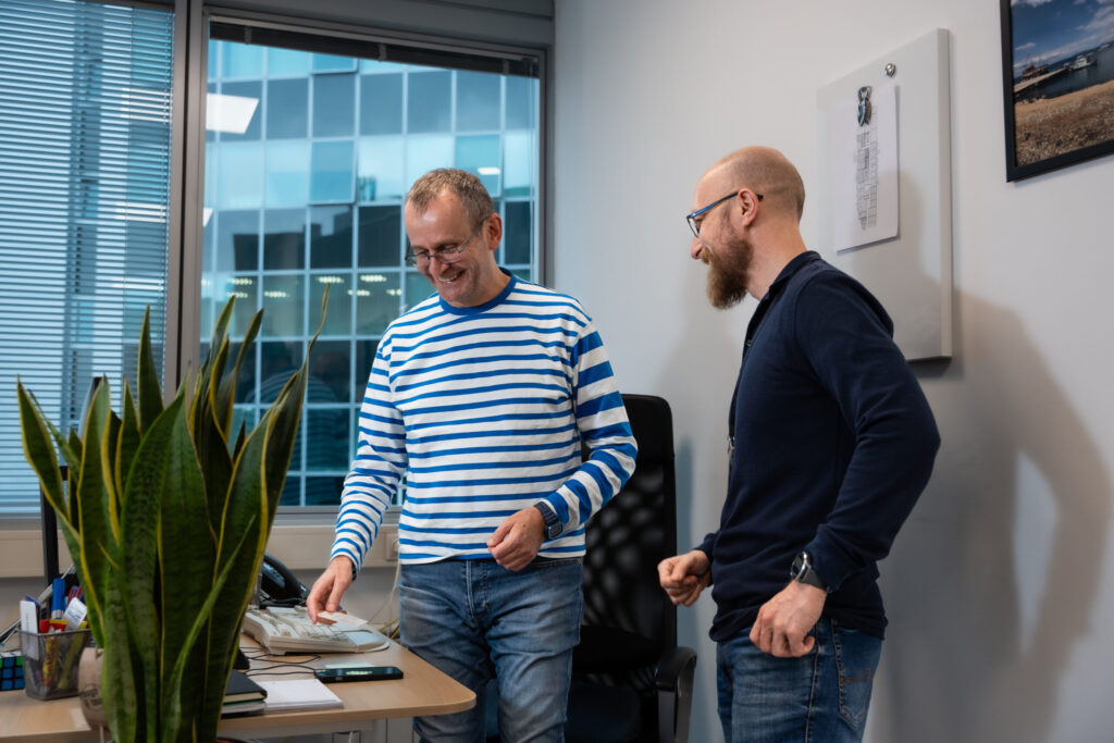 Two men talk in the Spyrosoft office in Zagreb.